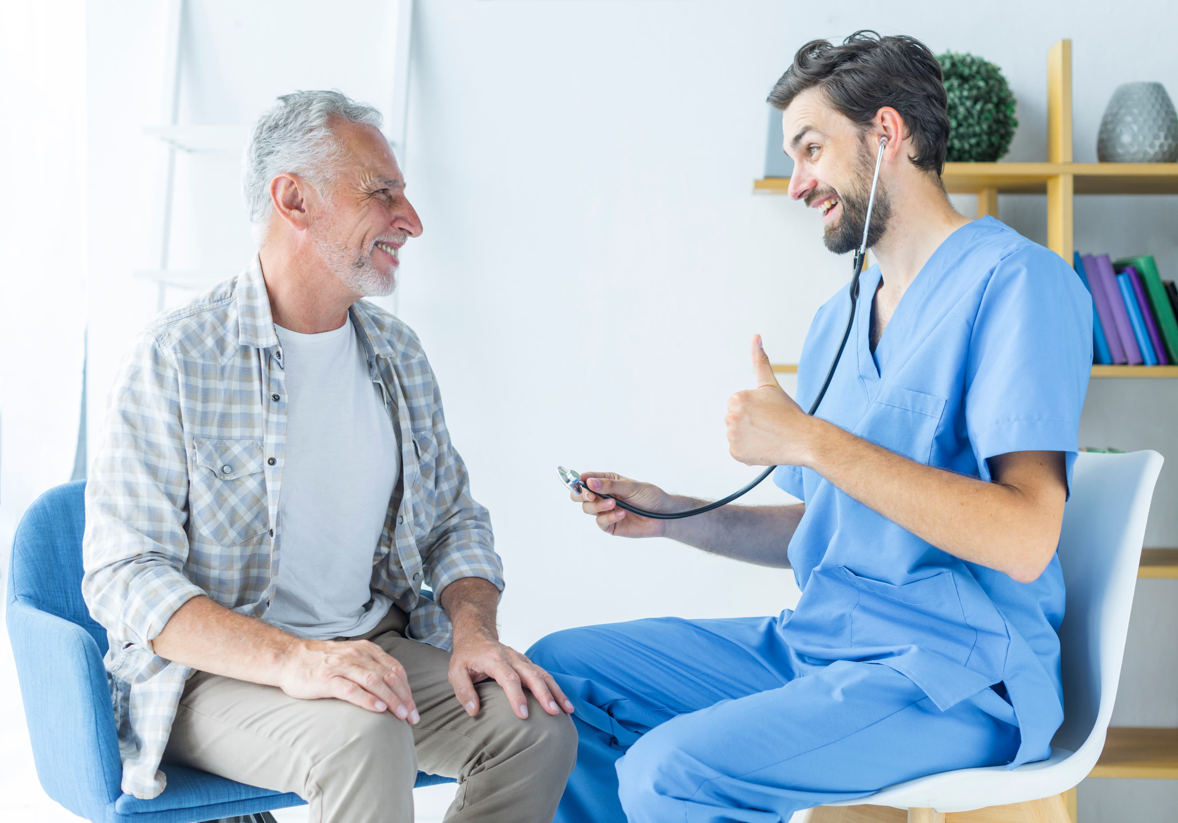 Doctor giving a patient a positive checkup at home